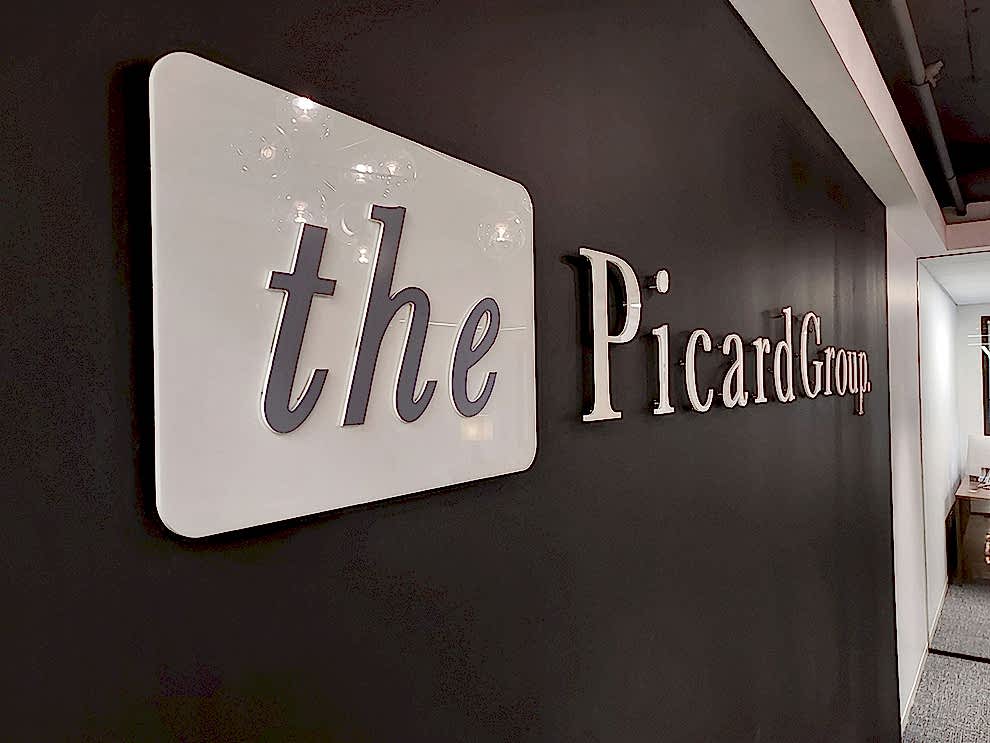 Acrylic Signs in Concord, NC designed and installed for business office walls and branded interiors