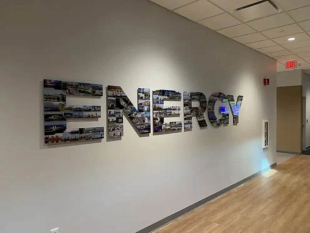 Dimensional Letters in Charlotte, NC designed and installed with brushed metal finishes for offices