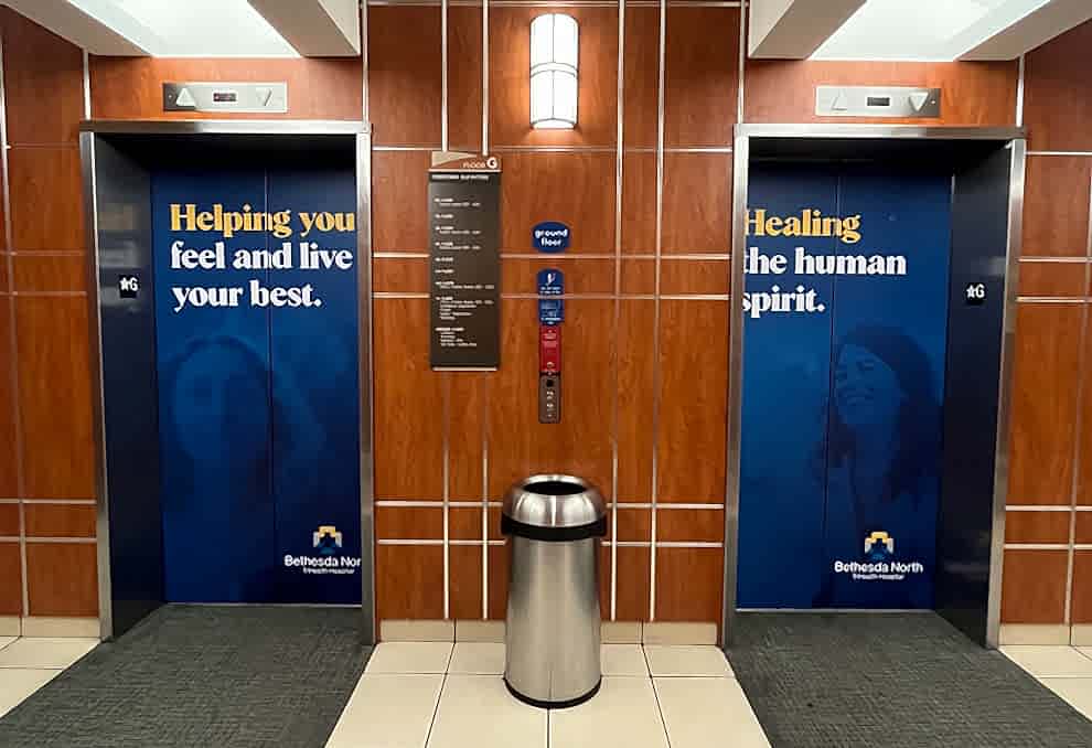 Elevator Wraps in Charlotte, NC designed and installed for office cab walls and elevator doors