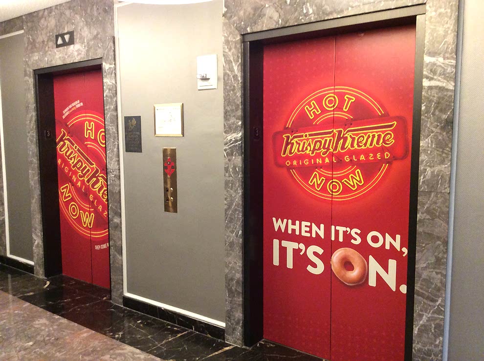 Elevator Wraps in Charlotte, NC designed and installed for workplace environments and brand identity