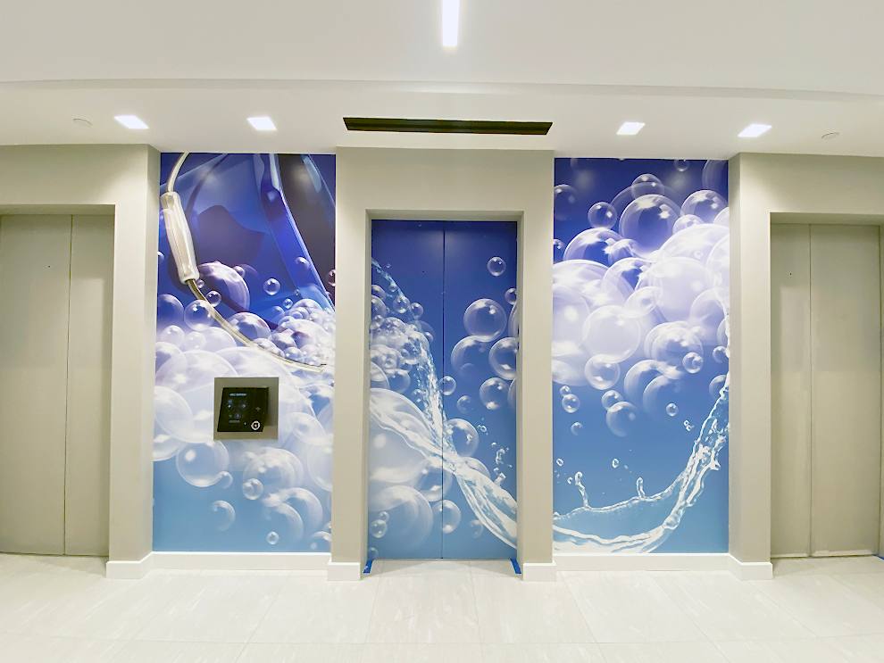 Elevator Wraps in Charlotte, NC designed and installed for elevator door graphics and workplace branding