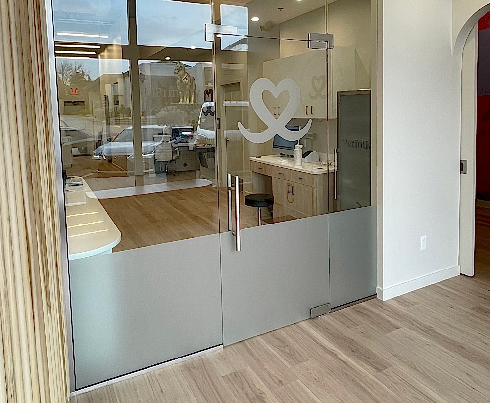 Frosted Vinyl in Charlotte, NC designed and installed for branded privacy glass and hallway doors