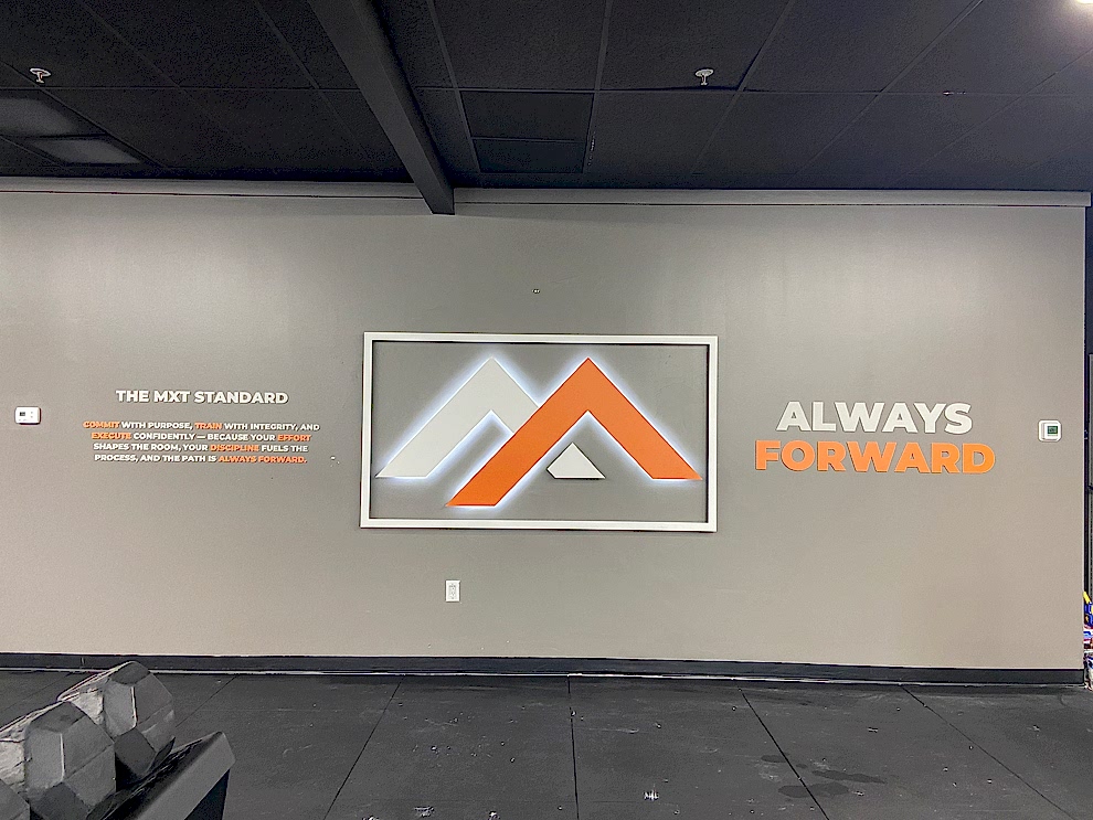 Sign Shop Charlotte NC designed and installed lobby wall displays for workplace interiors