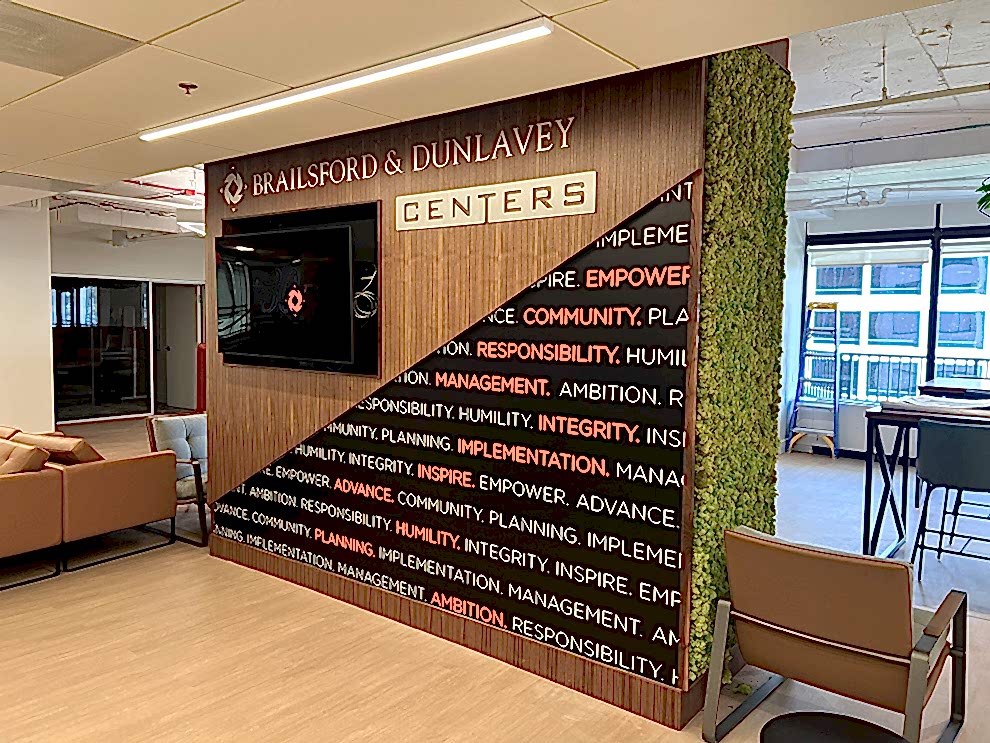 Lobby Signs Charlotte NC designed and installed to modernize workplace reception areas with branded graphics