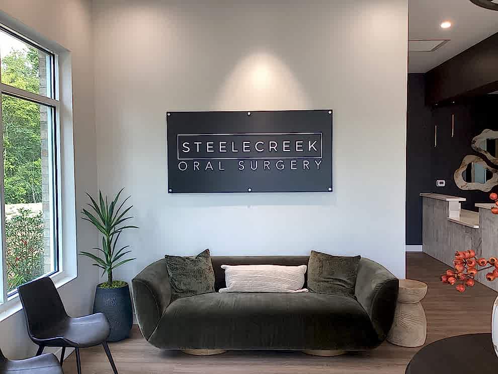 Standoff Mounted Signs in Charlotte, NC designed and installed for corporate office interiors and brand enhancement