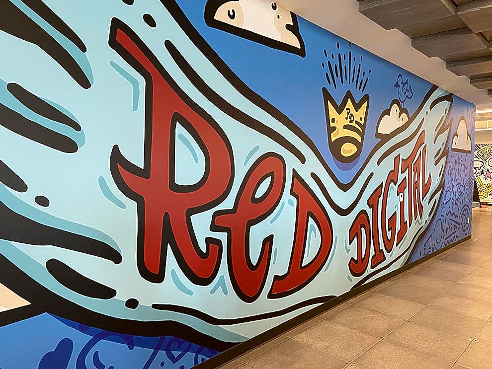 Creative workplace wall mural installation in Charlotte, NC office interior