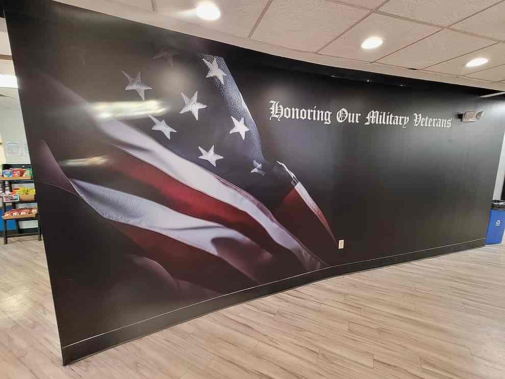 Corporate office wall mural with branding elements in Concord, NC