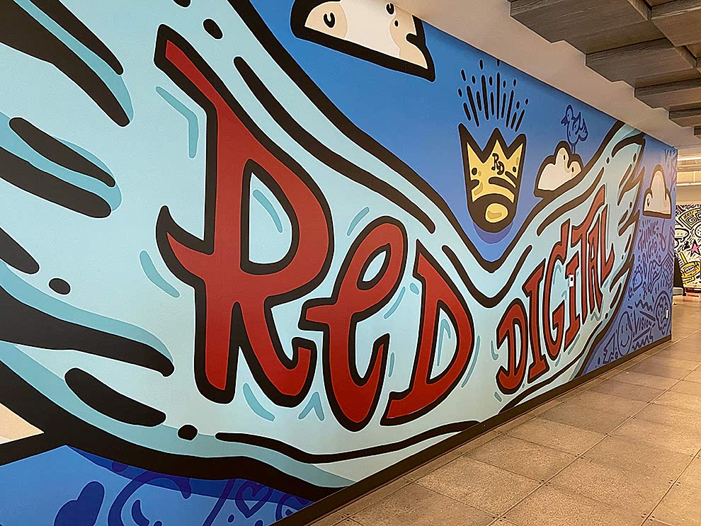 Creative workplace wall mural installation in Concord, NC office interior