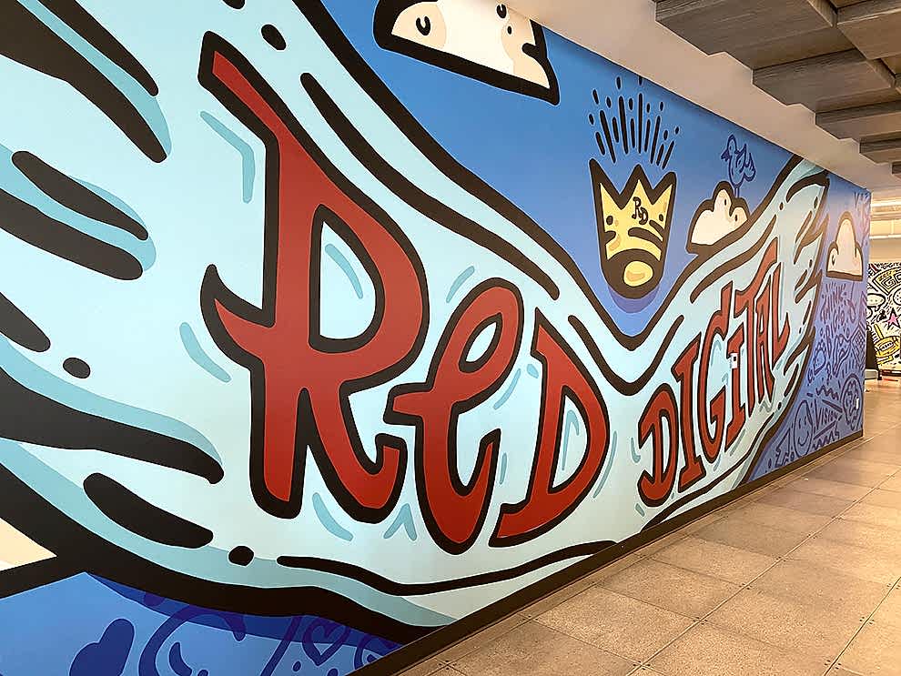 Creative workplace wall mural installation in Gastonia, NC office interior