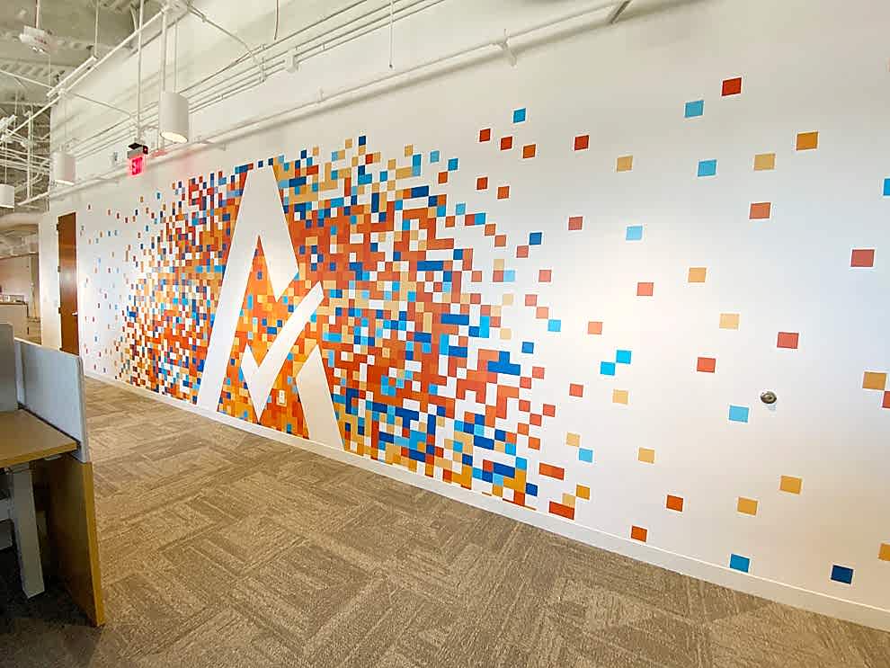 Reception area wall mural with custom branding Mooresville, NC office