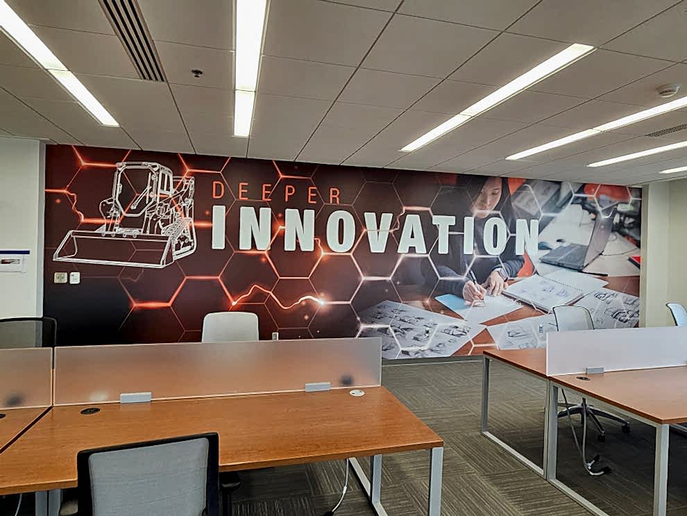 Custom wall wrap graphics enhancing corporate interiors in Mooresville, NC