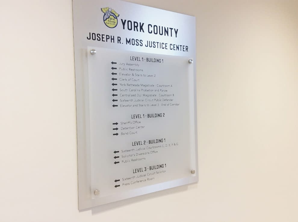Wayfinding signs and directional graphics guiding workplace navigation in Charlotte, NC