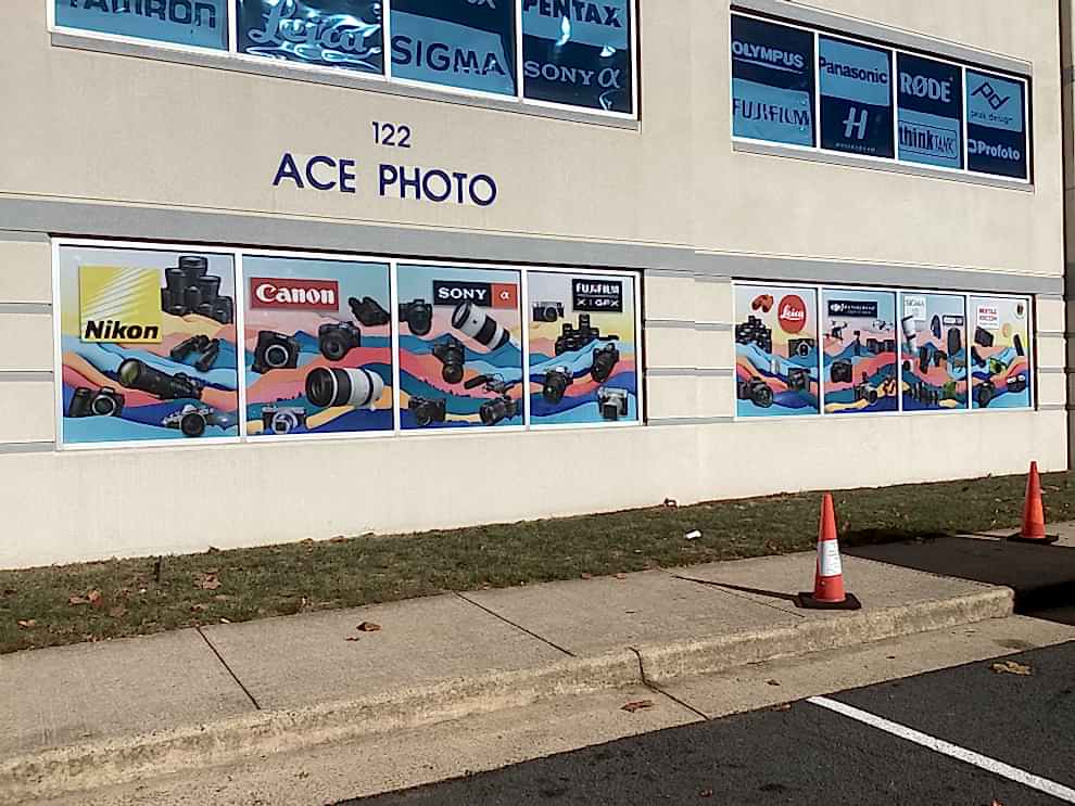 Window Graphics in Charlotte, NC designed and installed with branded vinyl lettering